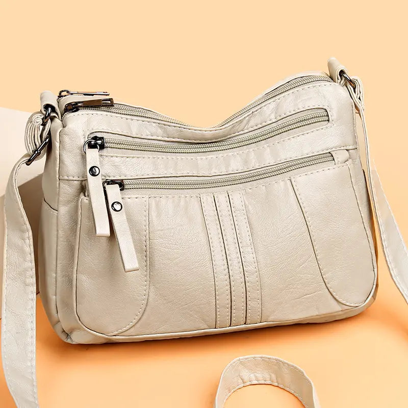 🥰【Ofertă specială pentru o perioadă limitată】👜Geantă de umăr nouă, de mare capacitate, din piele moale, disponibilă în patru culori