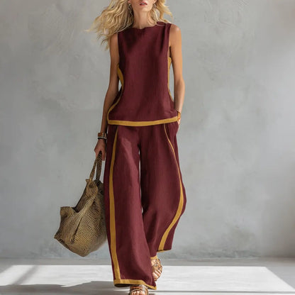 🔥😍【Top + Pantaloni】Set nou și modern din două piese pentru femei: top fără mâneci cu detalii contrastante și pantaloni cu croi larg