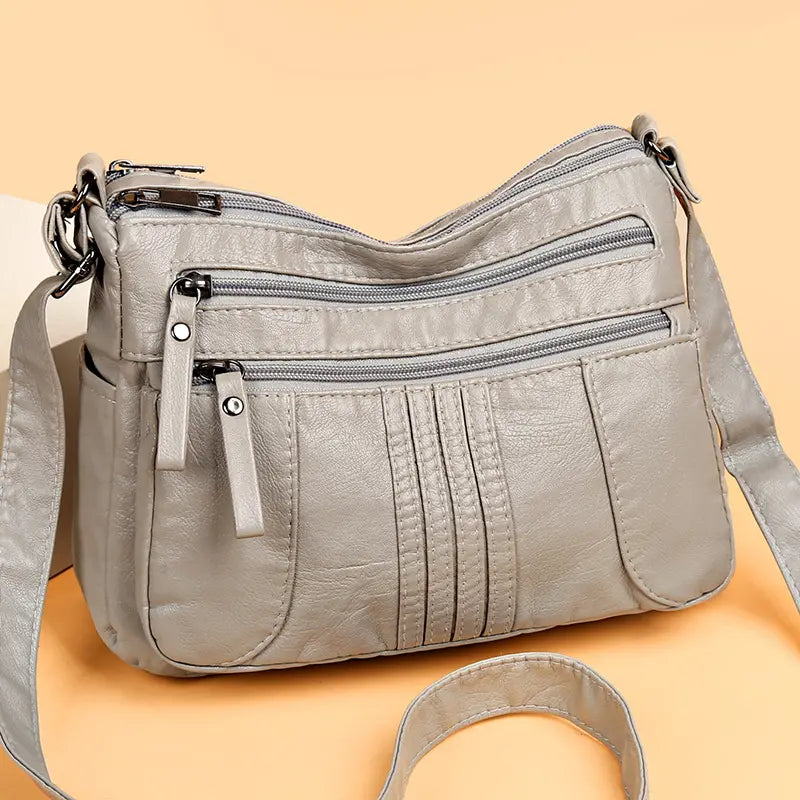 🥰【Ofertă specială pentru o perioadă limitată】👜Geantă de umăr nouă, de mare capacitate, din piele moale, disponibilă în patru culori