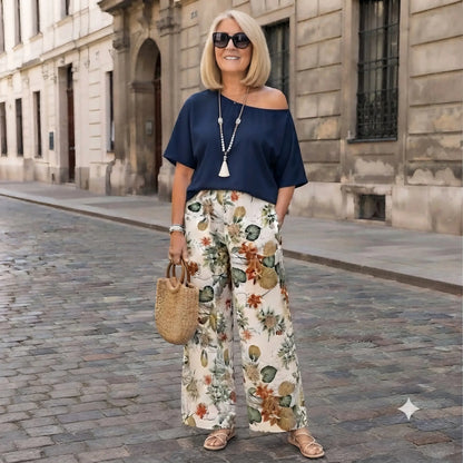 🎁【Mărimi moderne, mărimi mari】Set imprimat format din 2 piese (bluză cu umeri asimetrici + pantaloni cu croi larg)
