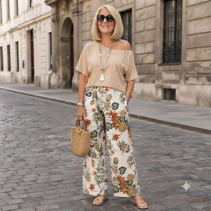 🎁【Mărimi moderne, mărimi mari】Set imprimat format din 2 piese (bluză cu umeri asimetrici + pantaloni cu croi larg)