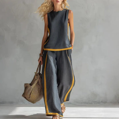 🔥😍【Top + Pantaloni】Set nou și modern din două piese pentru femei: top fără mâneci cu detalii contrastante și pantaloni cu croi larg